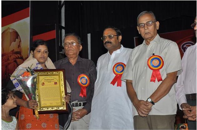 Martyr's widow is felicited by Bharat Raksha Manch during the observation of August Kranti Divas - 2014
